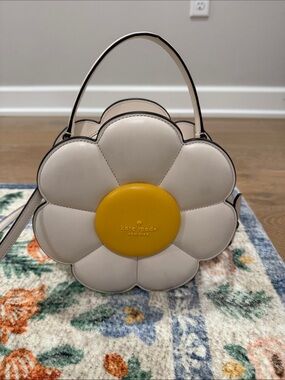 kate spade cream daisy mini bag with yellow center